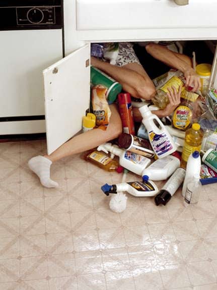 Photographs of People Crammed into Uncomfortable Spaces 