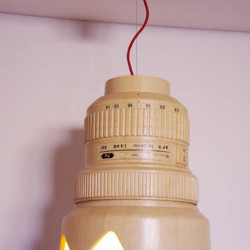 A Wooden Hanging Lamp Shaped Like a Giant Nikon 12-24mm Lens