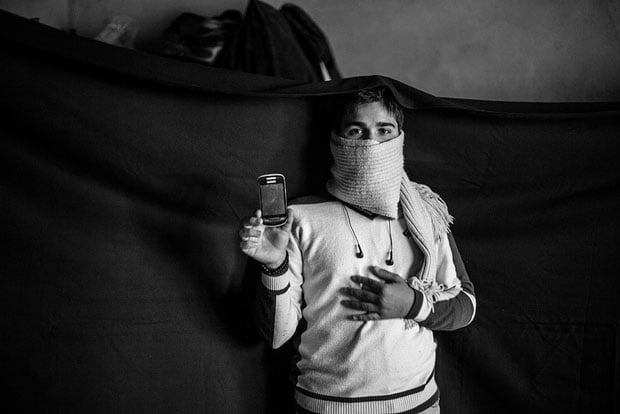 The most important thing Yusuf was able to bring when he fled Syria is the mobile phone he holds in this photograph. "With this, I'm able to call my father. We're close enough to Syria here that I can catch a signal from the Syrian towers sometimes, and then it is a local call to call home from Lebanon." The phone also holds photographs of family members who are still in Syria, which he is able to keep with him at all times.