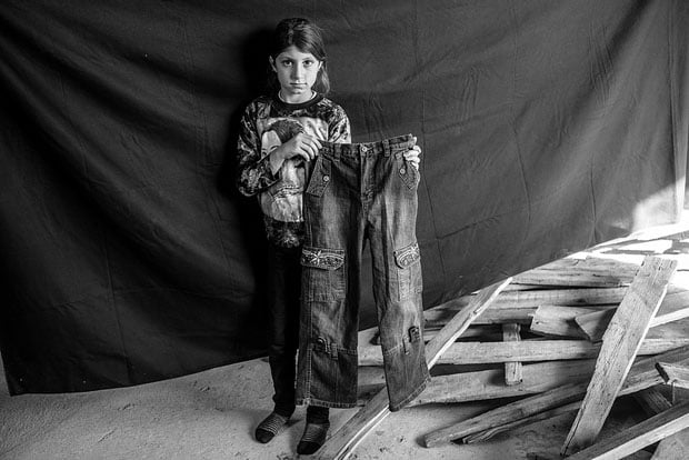 The most important thing Leila was able to bring with her are the jeans she holds in this photograph. "I went shopping with my parents one day and looked for hours without finding anything I liked. But when I saw these, I knew instantly that these were perfect because they have a flower on them, and I love flowers." She has only worn the jeans three times, all in Syria – twice to wedding parties, and once when she went to visit her grandfather. She says she won't wear them again until she attends another wedding, and she hopes it, too, will be in Syria.
