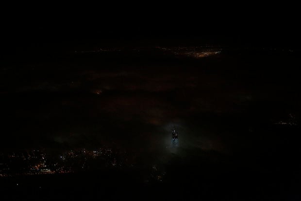 A Photo of the One World Trade Center Poking Up Above Low Clouds wtconeb